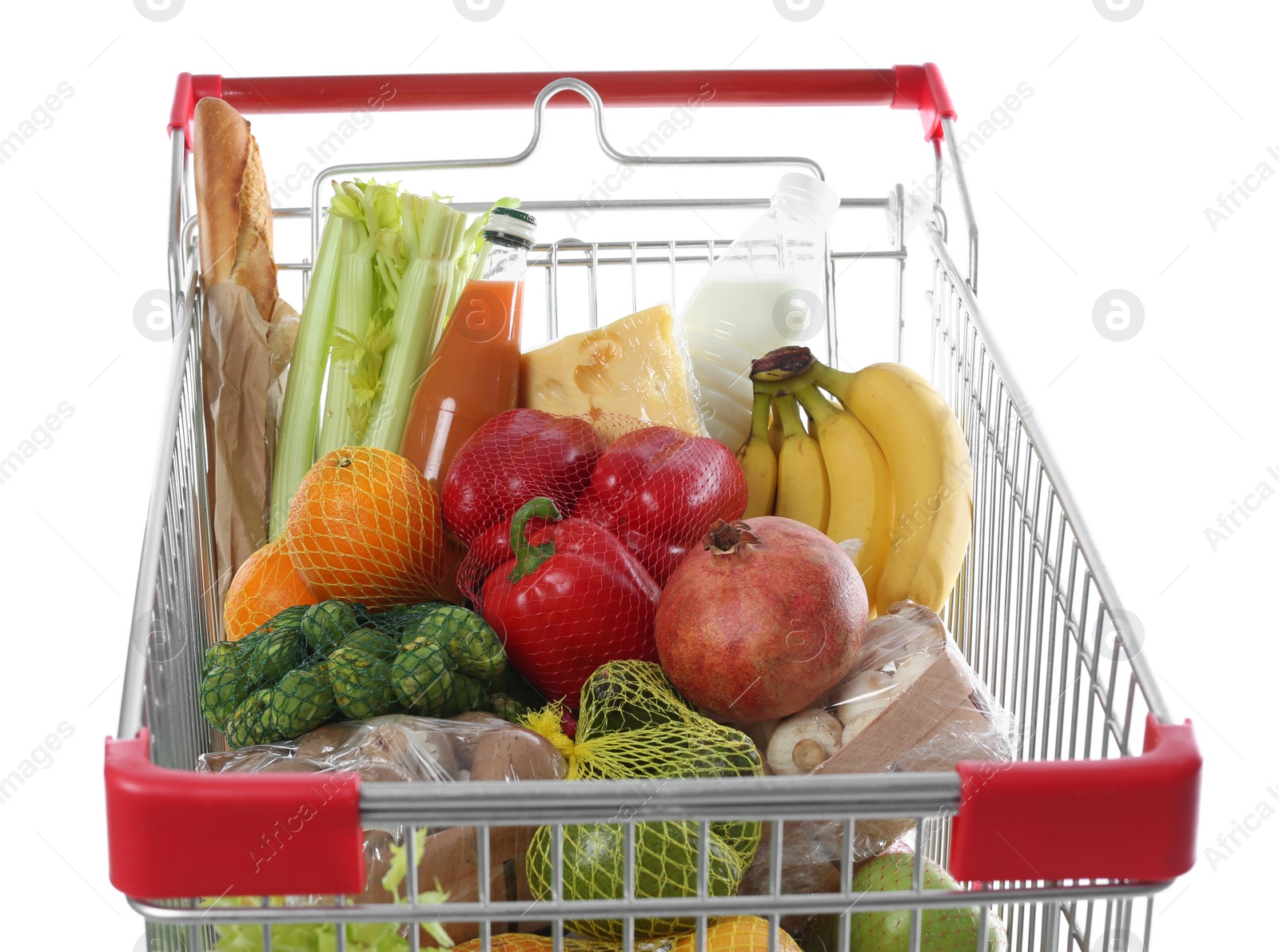 Photo of Shopping cart with fresh groceries on white background