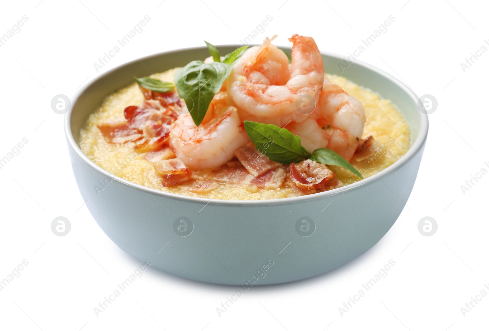 Photo of Fresh tasty shrimps, bacon, grits and basil in bowl isolated on white
