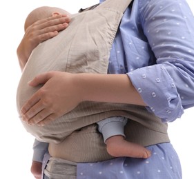 Mother holding her child in baby carrier on white background, closeup