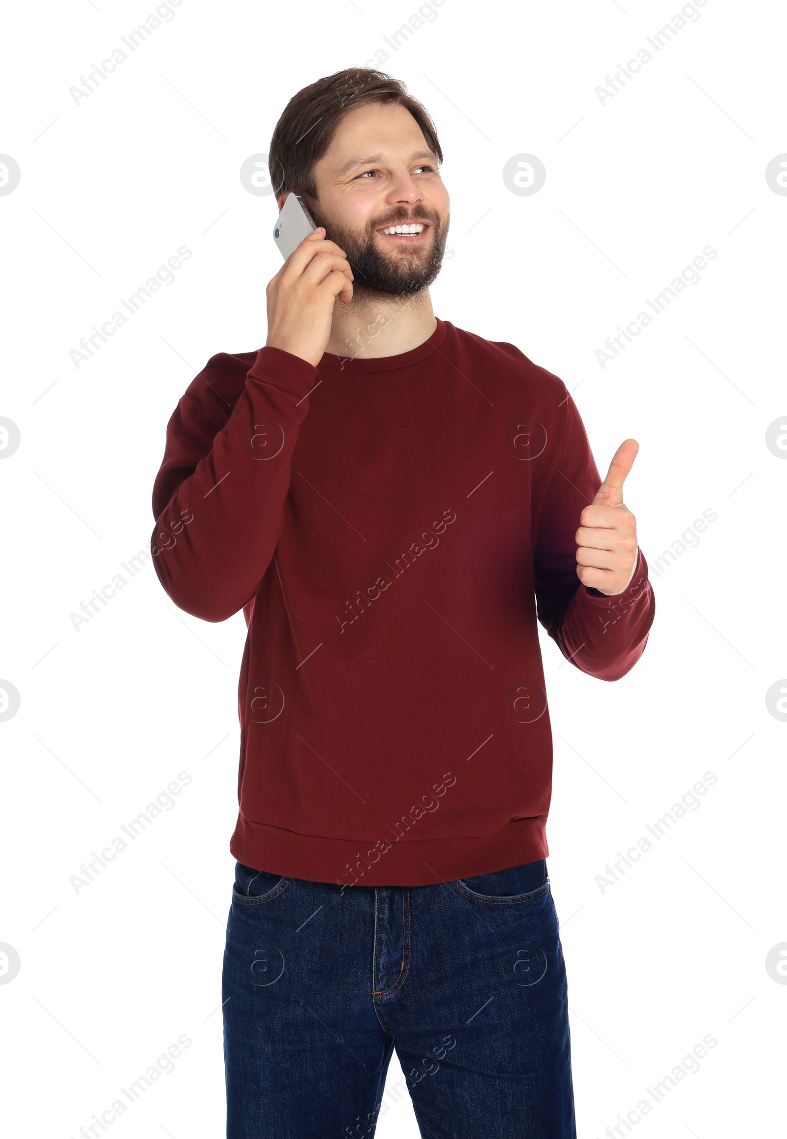 Photo of Man talking on smartphone against white background