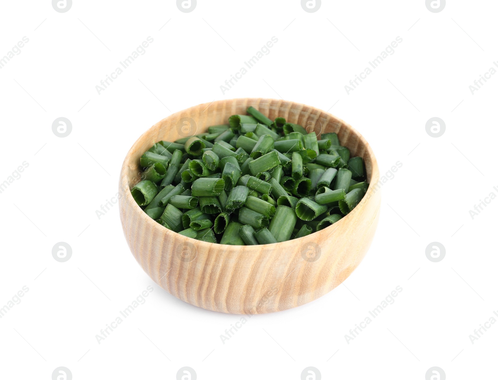 Photo of Cut green spring onion in wooden bowl isolated on white