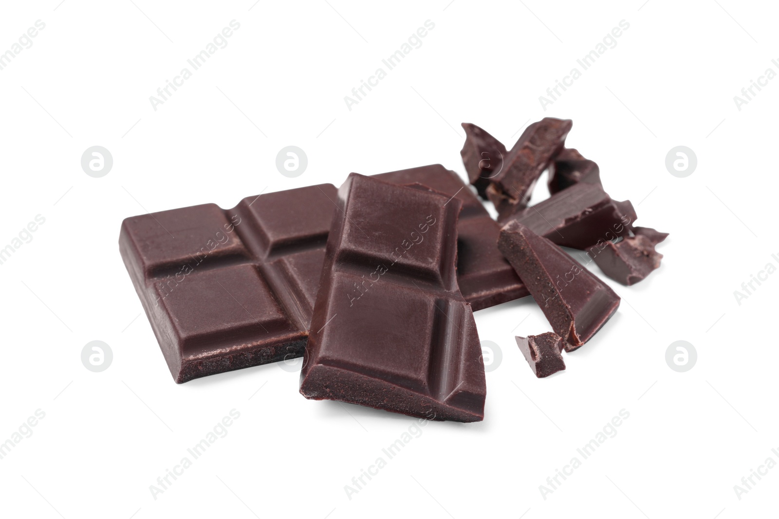 Photo of Pieces of delicious dark chocolate bar on white background