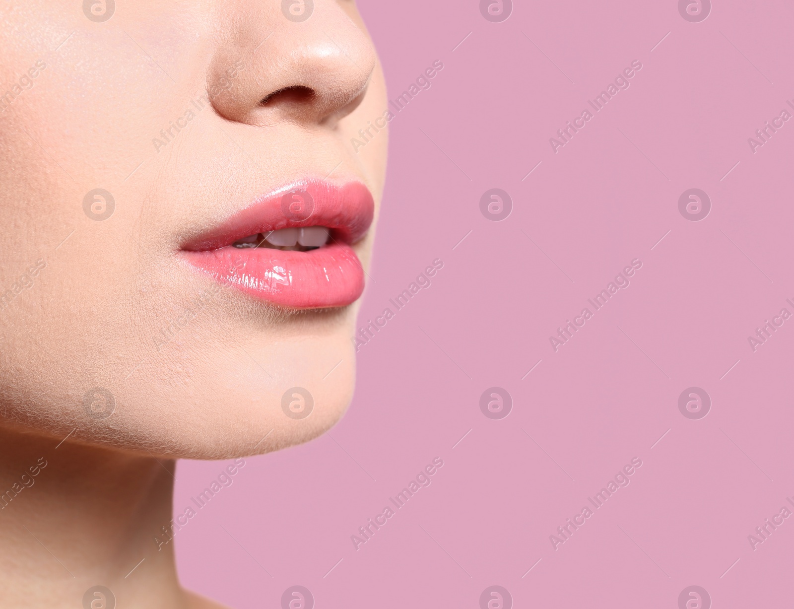 Photo of Beautiful young woman with perfect lips makeup on color background, closeup. Space for text