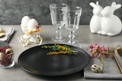 Photo of Festive Easter table setting with beautiful floral decor