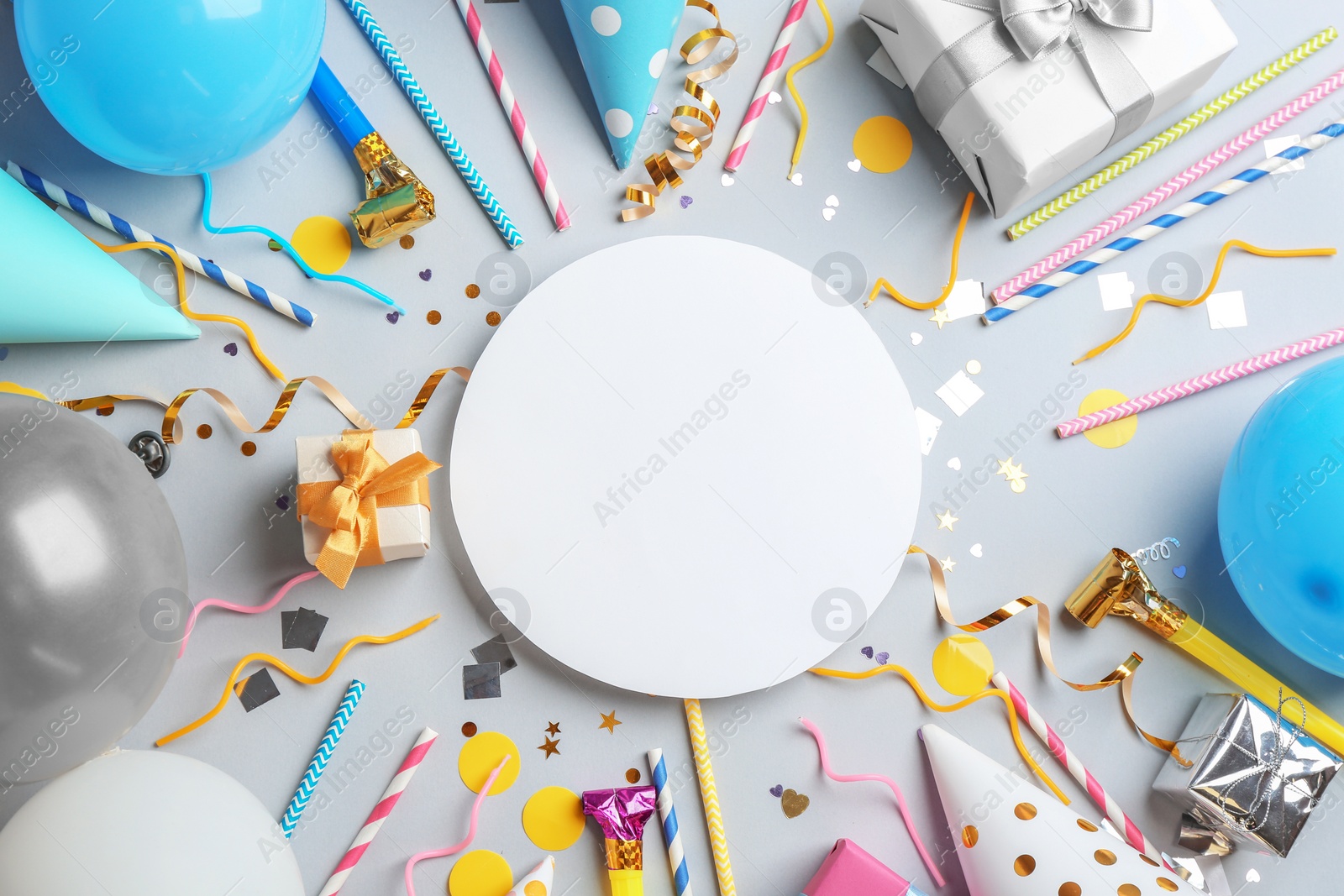 Photo of Flat lay composition with party accessories and space for text on grey background
