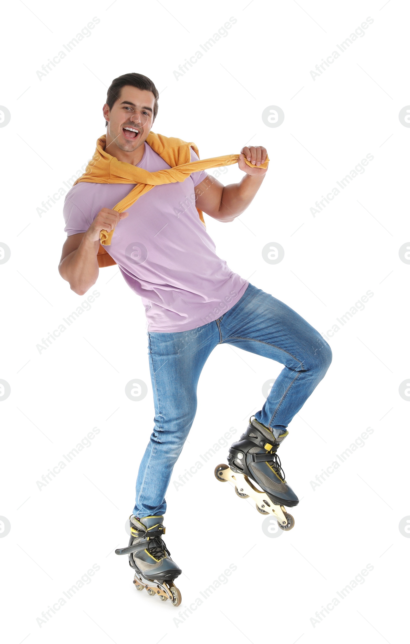 Photo of Handsome young man with inline roller skates on white background