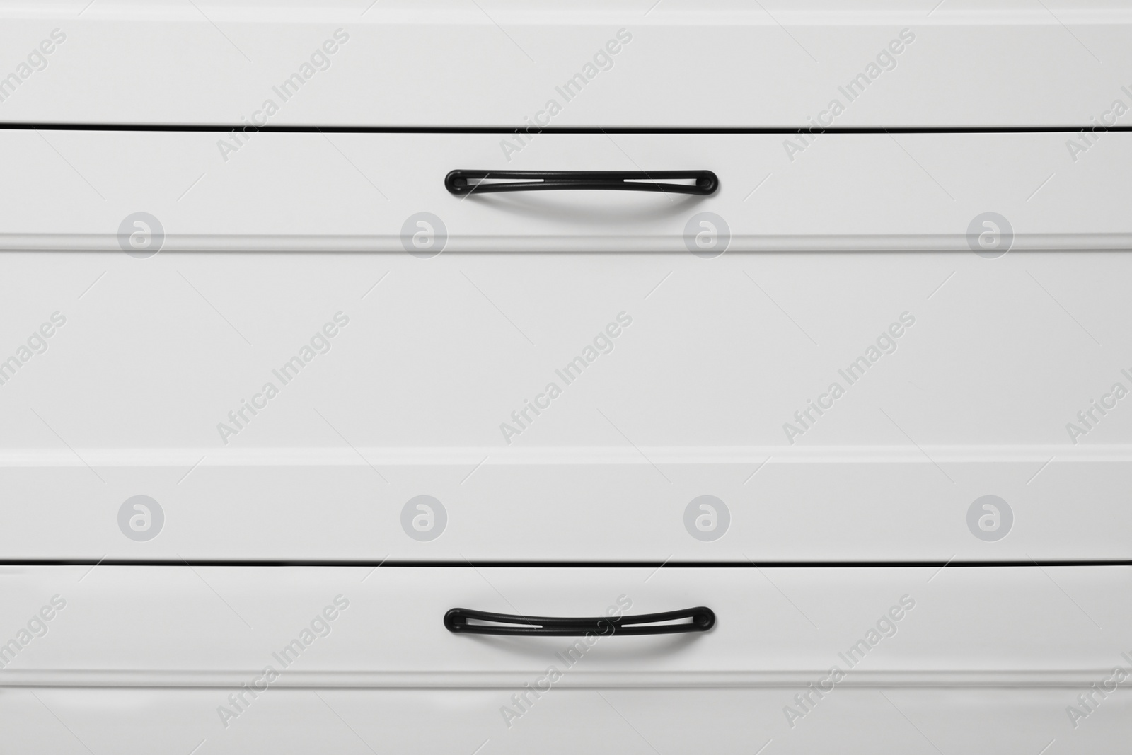 Photo of Modern white chest of drawers as background