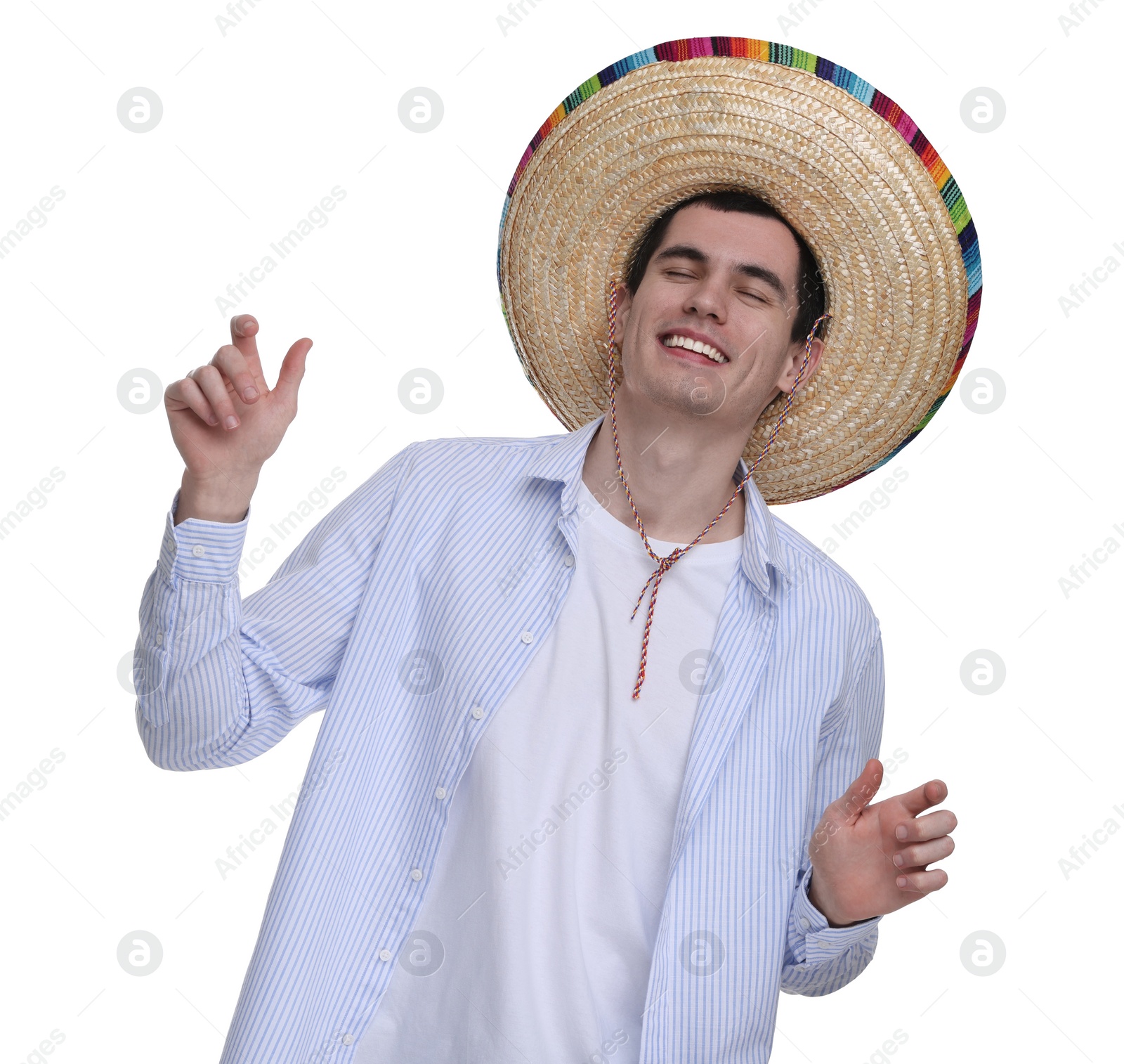 Photo of Young man in Mexican sombrero hat dancing on white background