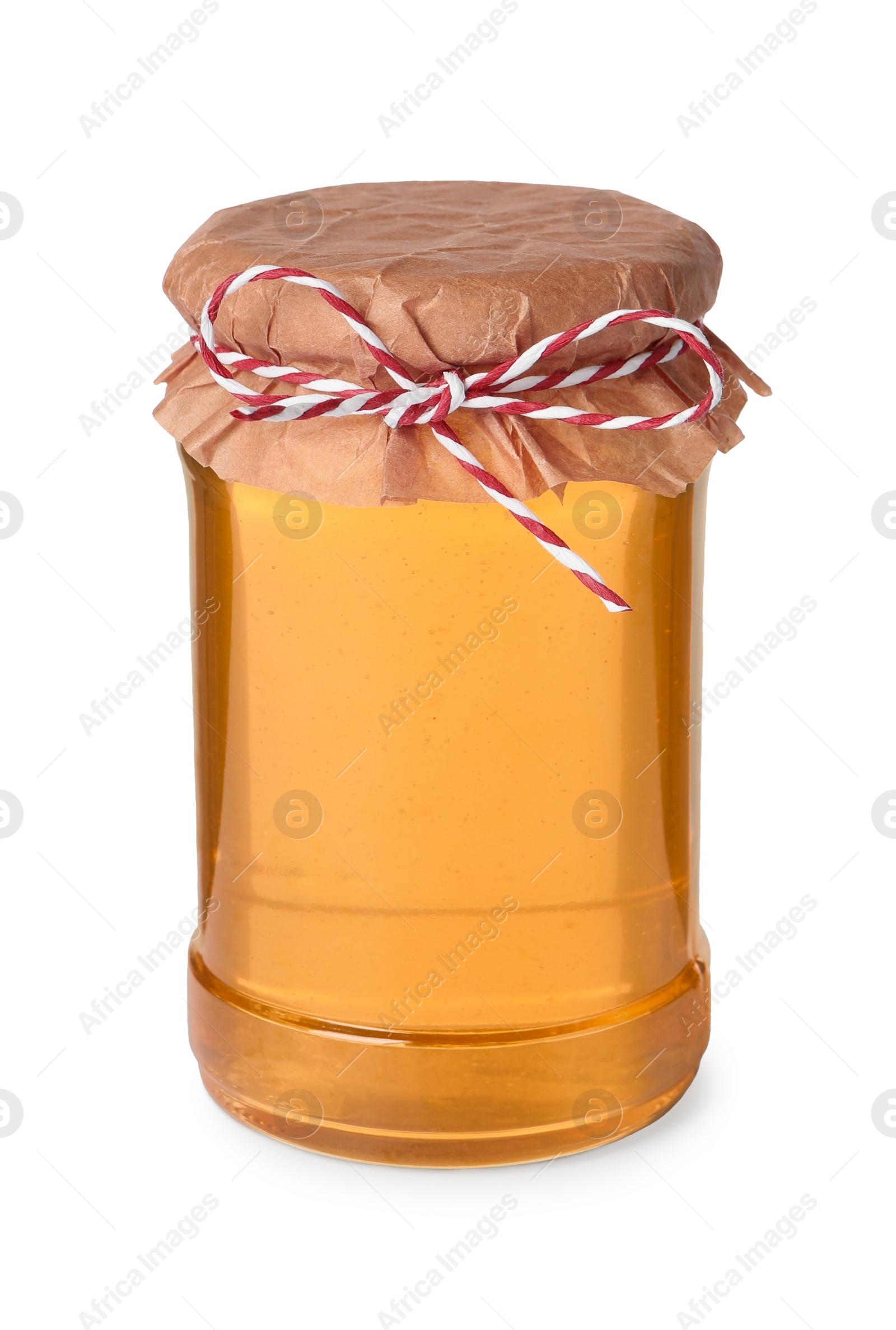 Photo of Tasty honey in glass jar isolated on white