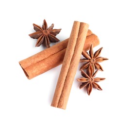 Photo of Cinnamon sticks and anise stars isolated on white, above view