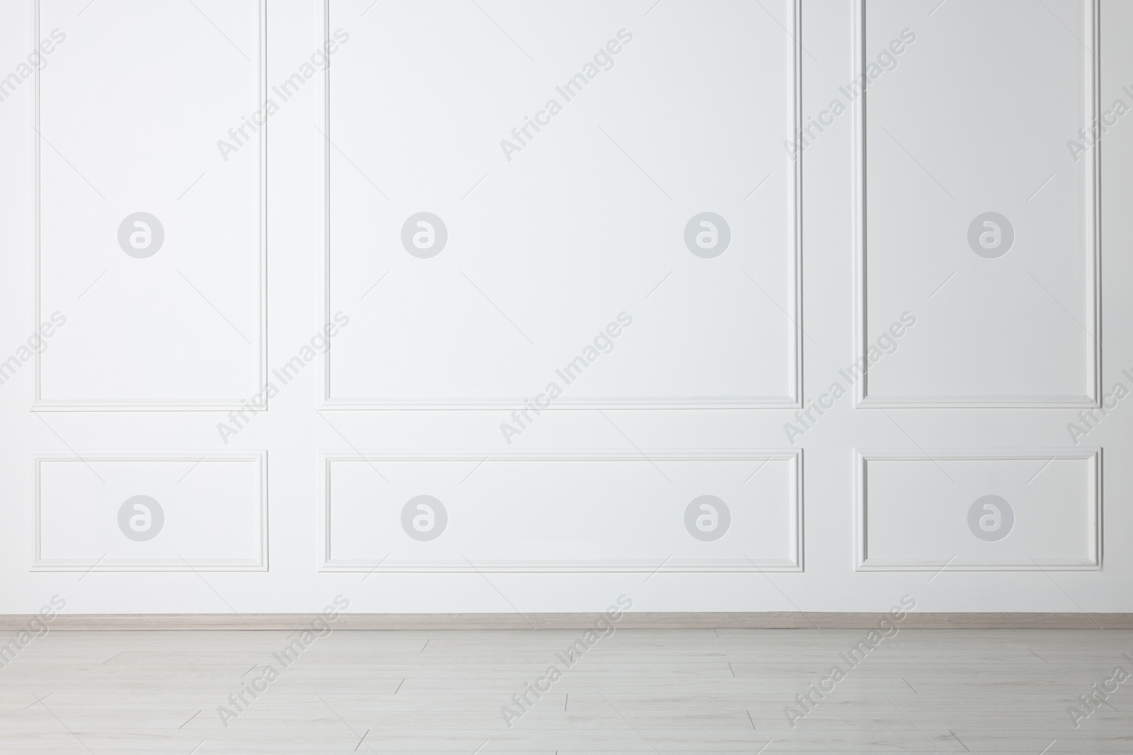 Photo of Beautiful room with white wall and wooden floor