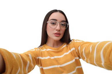 Young woman taking selfie on white background