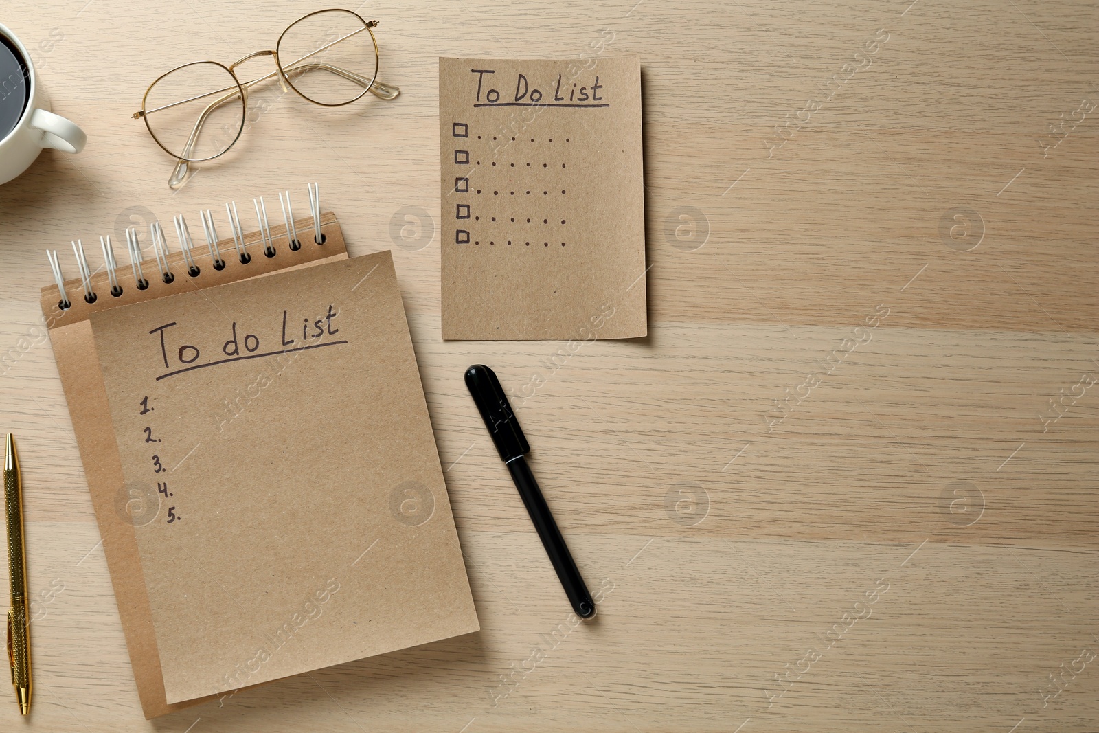 Photo of Flat lay composition with unfilled To Do lists and glasses on wooden table. Space for text