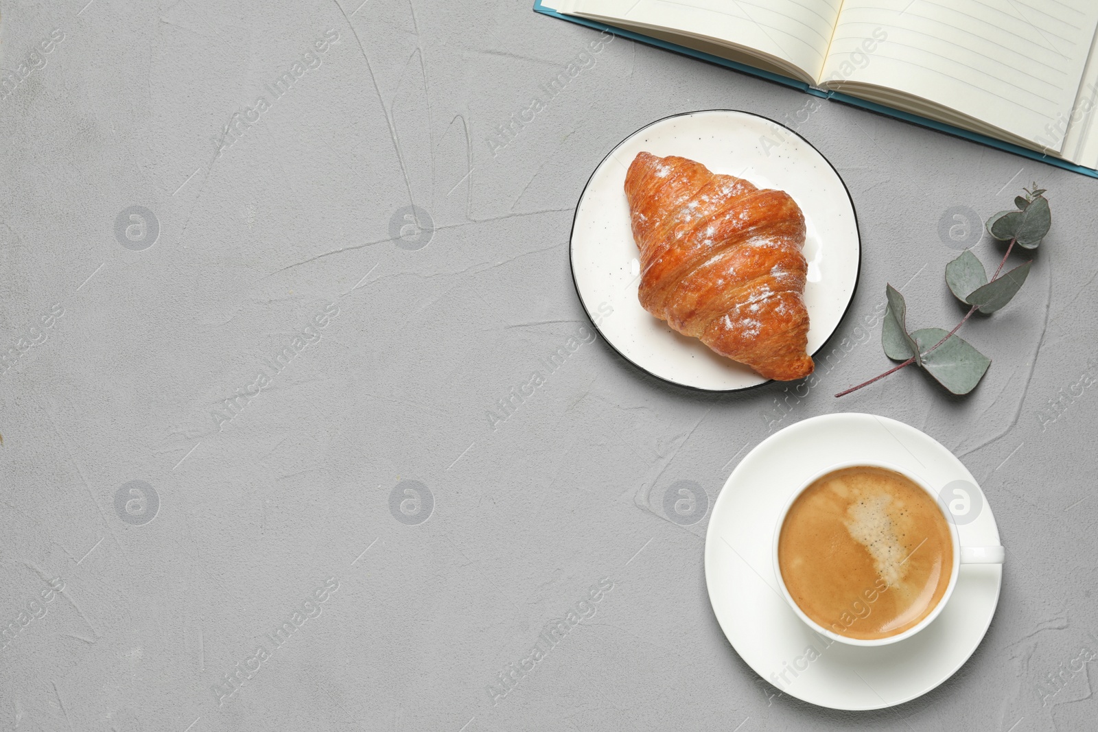 Photo of Tasty breakfast served on light grey table, flat lay. Space for text