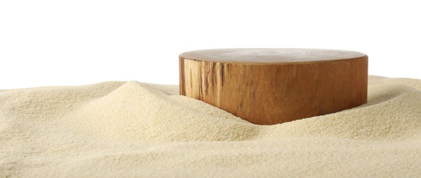 Photo of Presentation of product. Wooden podium on sand against white background