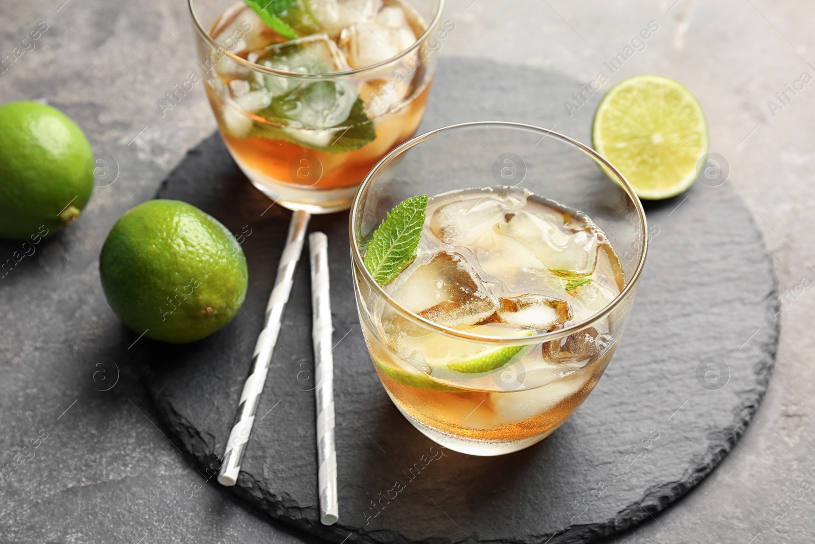 Photo of Delicious mint julep cocktail on slate plate