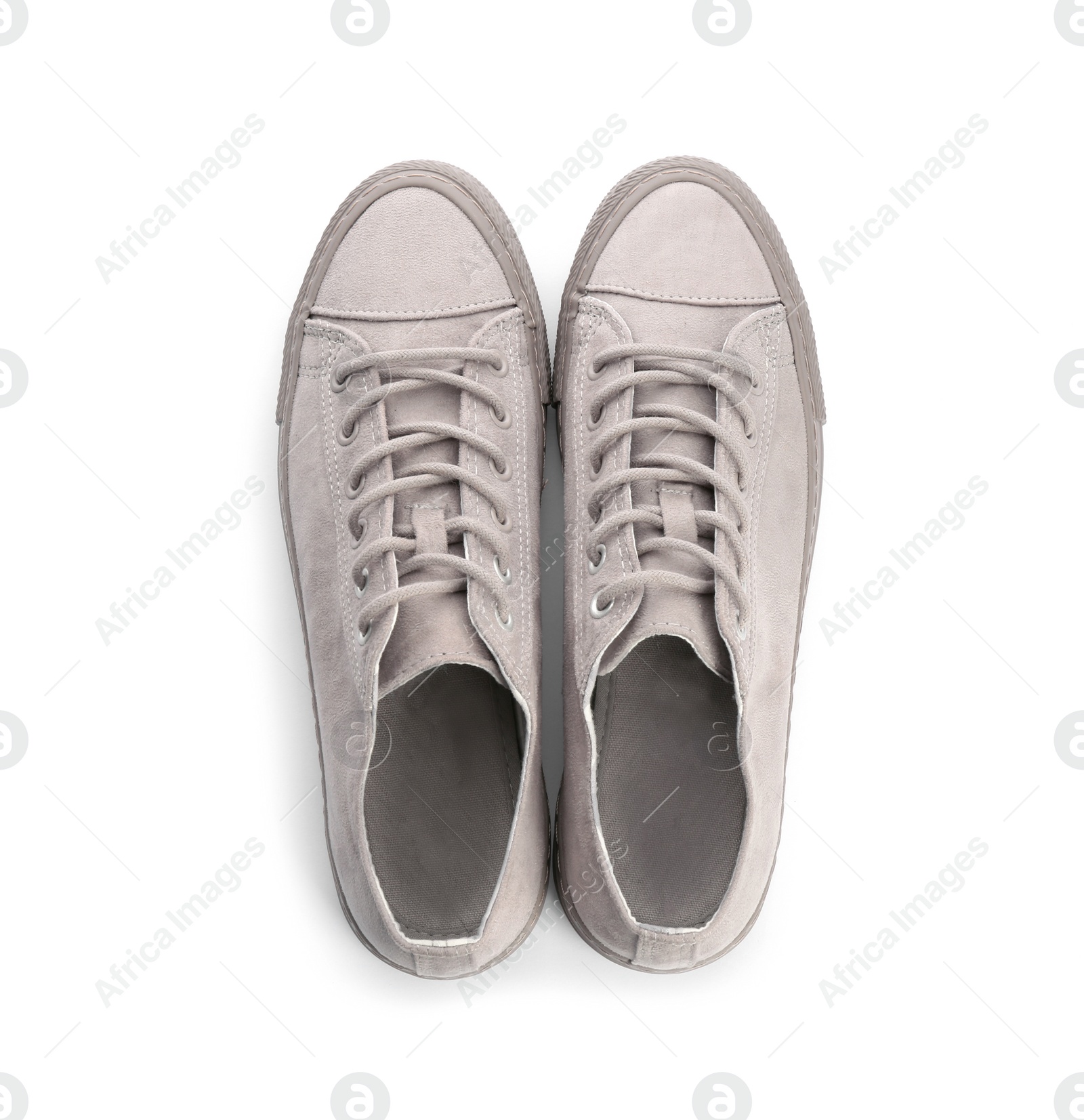 Photo of Pair of stylish sneakers on white background, top view