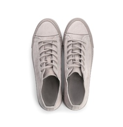 Pair of stylish sneakers on white background, top view