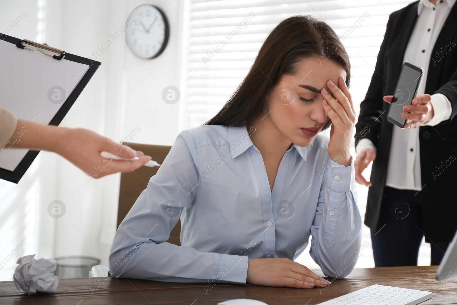 Photo of Businesswoman stressing out at workplace in office