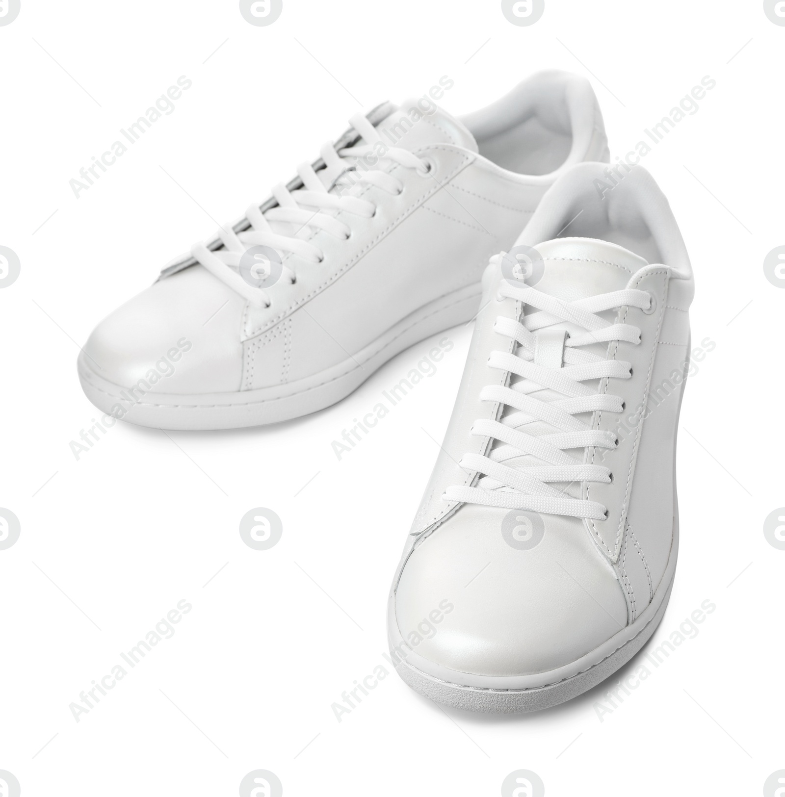 Photo of Pair of trendy sneakers on white background