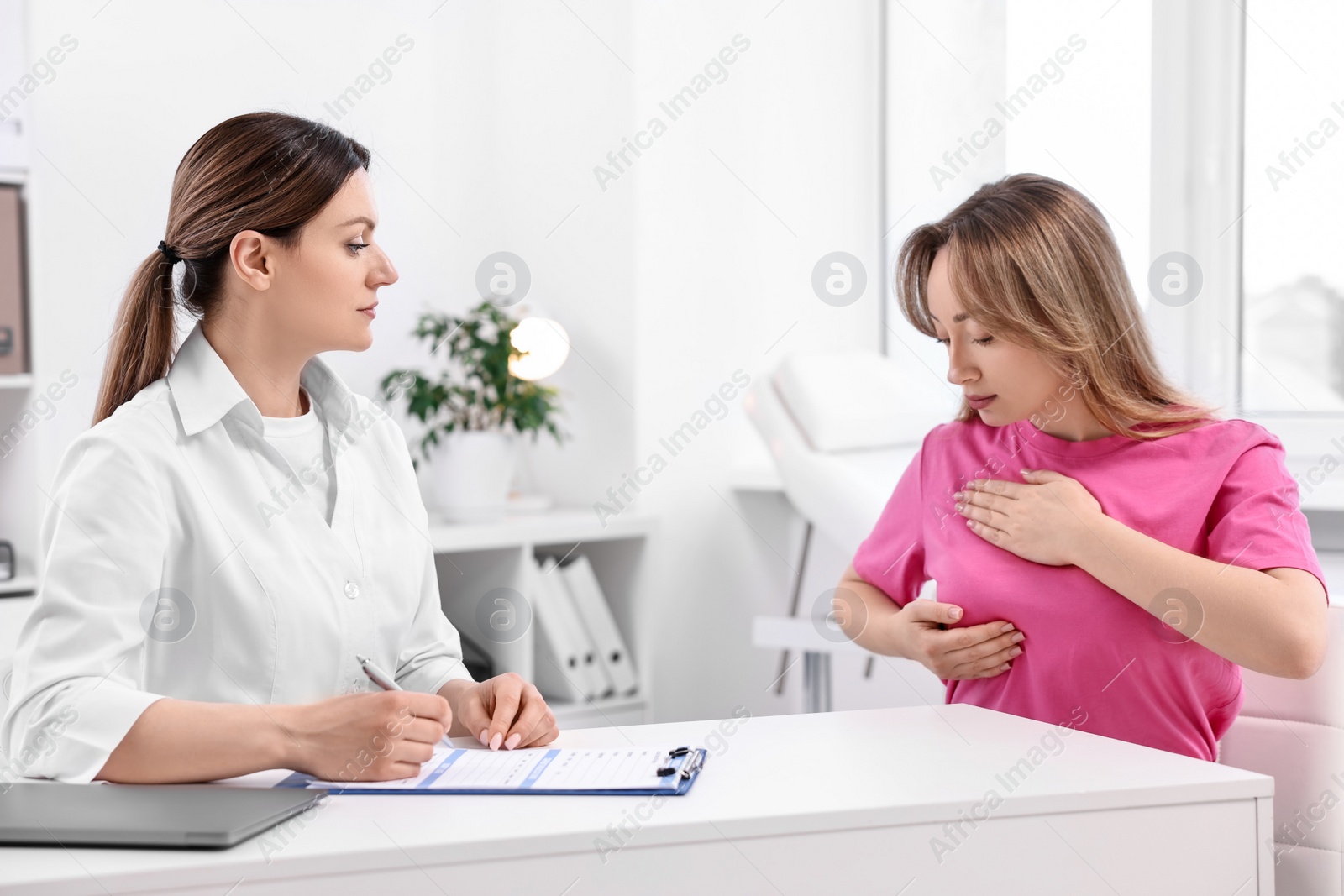 Photo of Mammologist consulting woman during appointment in hospital