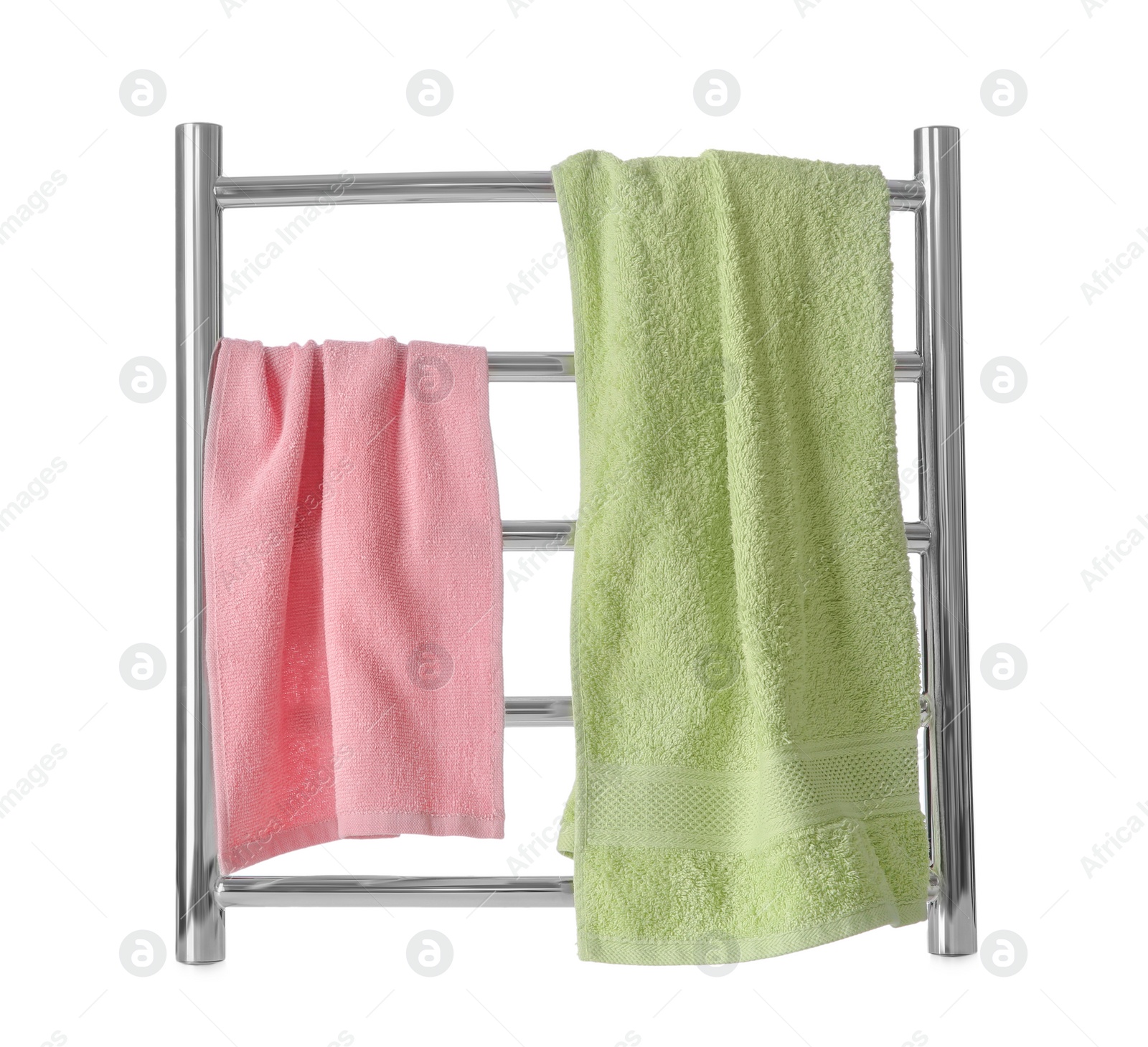 Photo of Modern heated towel rail with warm soft towels isolated on white