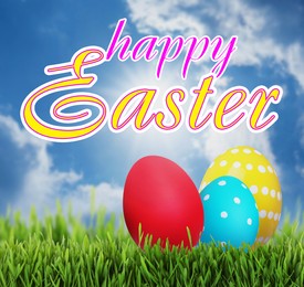 Image of Happy Easter. Bright eggs on green grass outdoors 