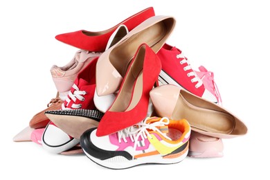 Pile of different female shoes isolated on white
