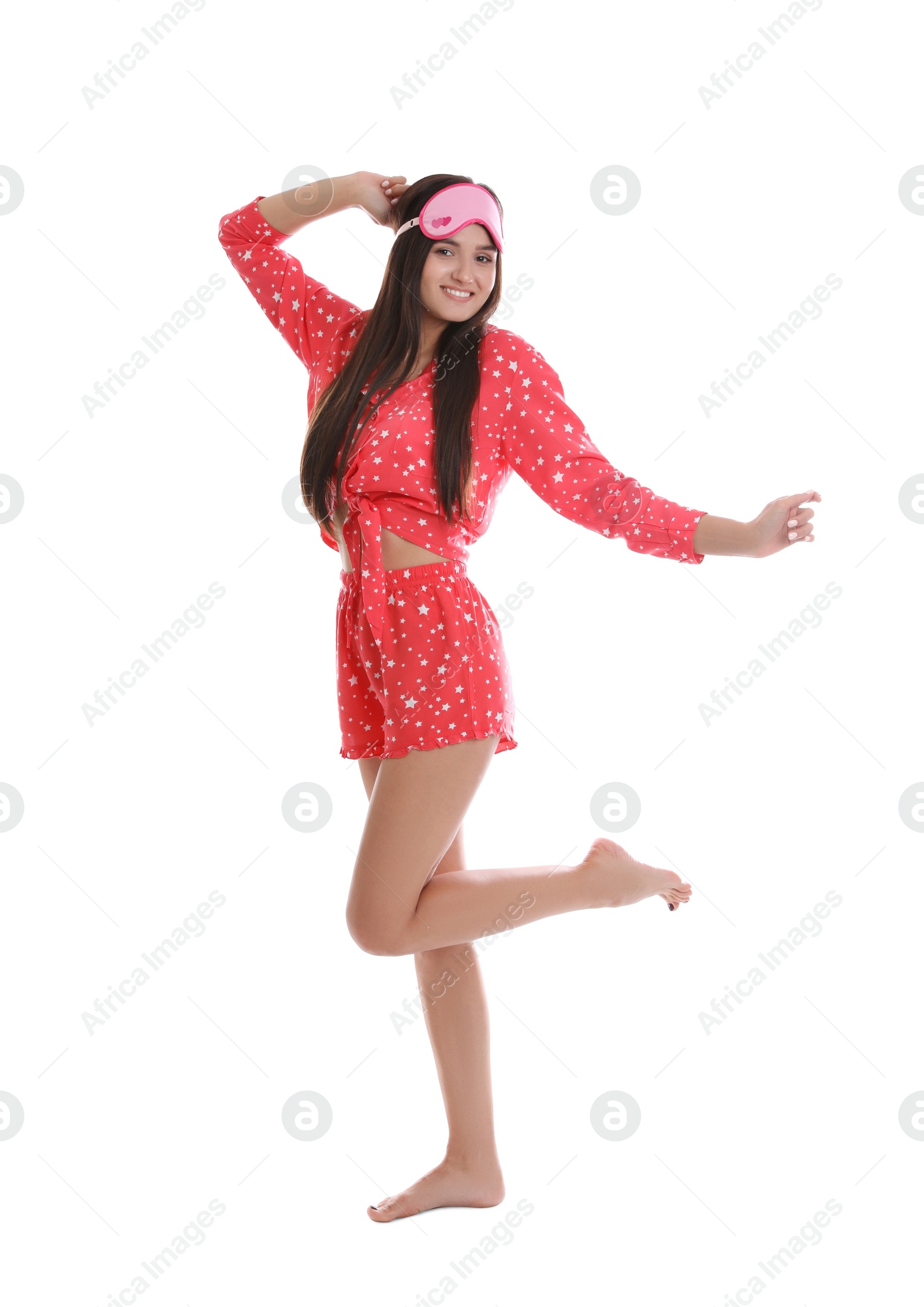 Photo of Beautiful woman wearing sleeping mask on white background. Bedtime