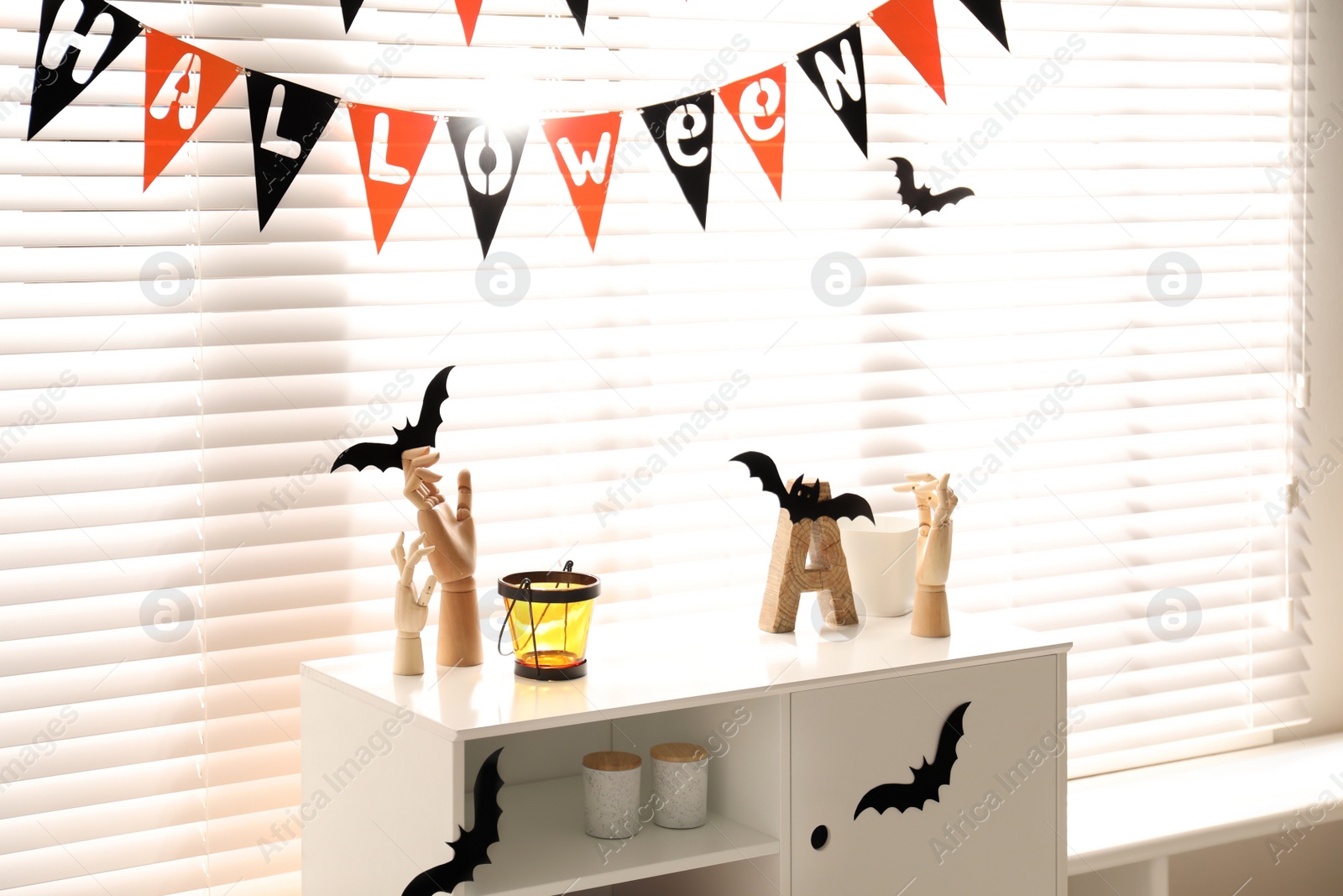 Photo of Stylish room interior with festive Halloween decor