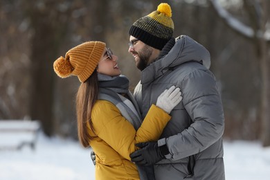 Beautiful happy couple outdoors on winter day