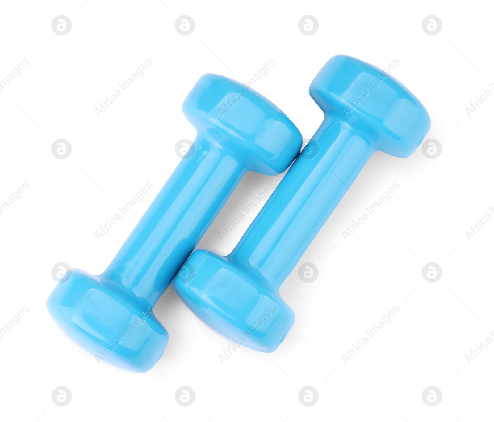Photo of Light blue dumbbells isolated on white, top view. Sports equipment