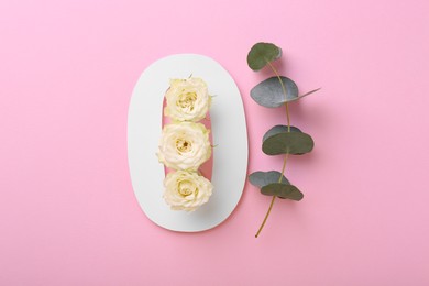 Photo of Paper number 0, eucalyptus branch and beautiful rose flowers on pink background, flat lay