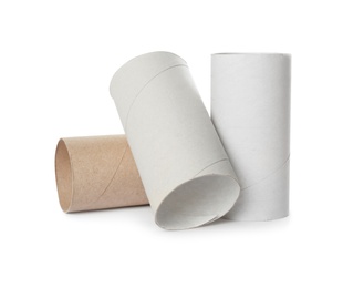 Empty toilet paper rolls on white background