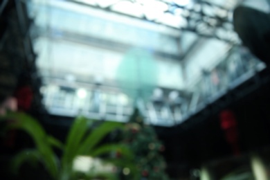 Blurred view of modern shopping mall interior