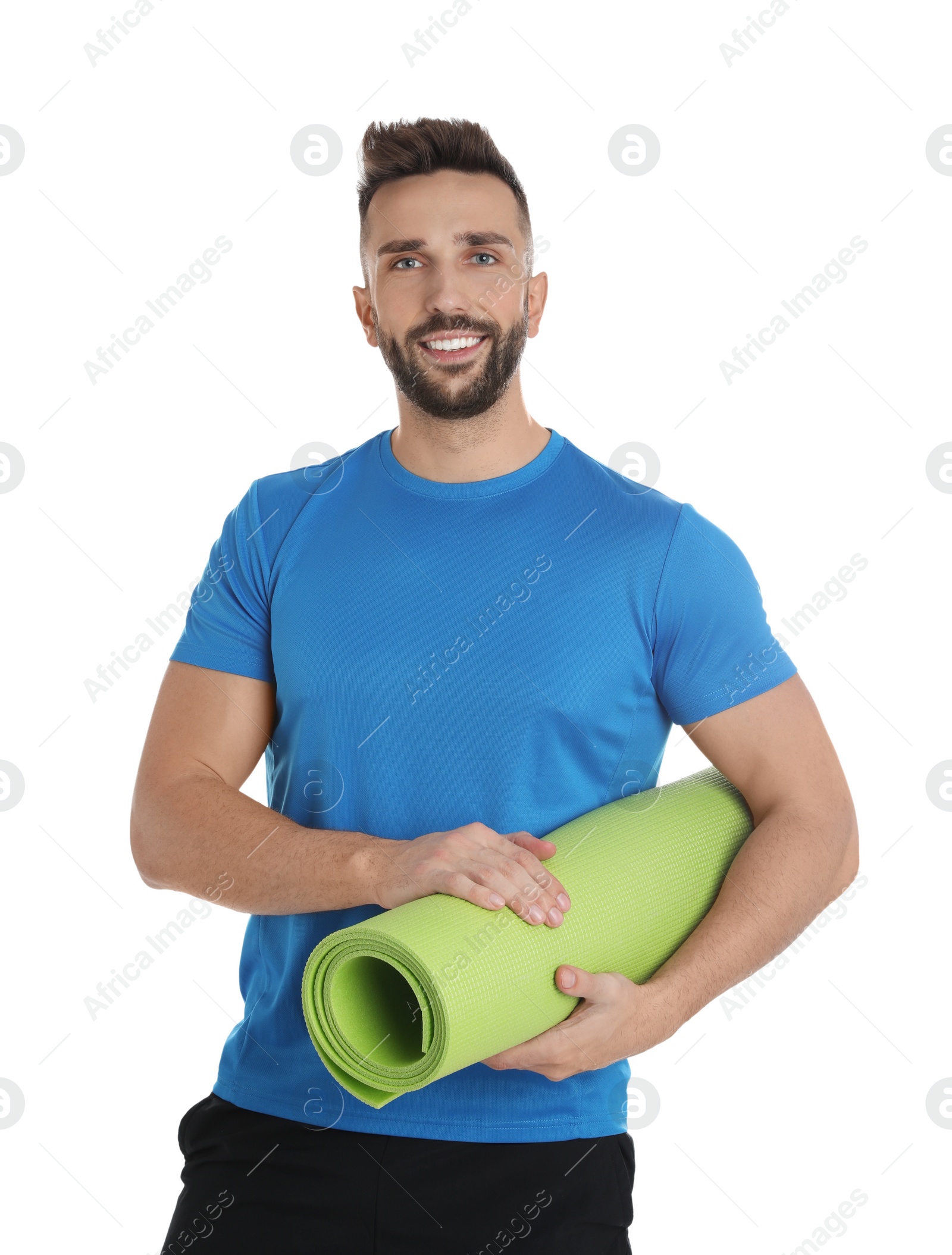 Photo of Handsome man with yoga mat on white background