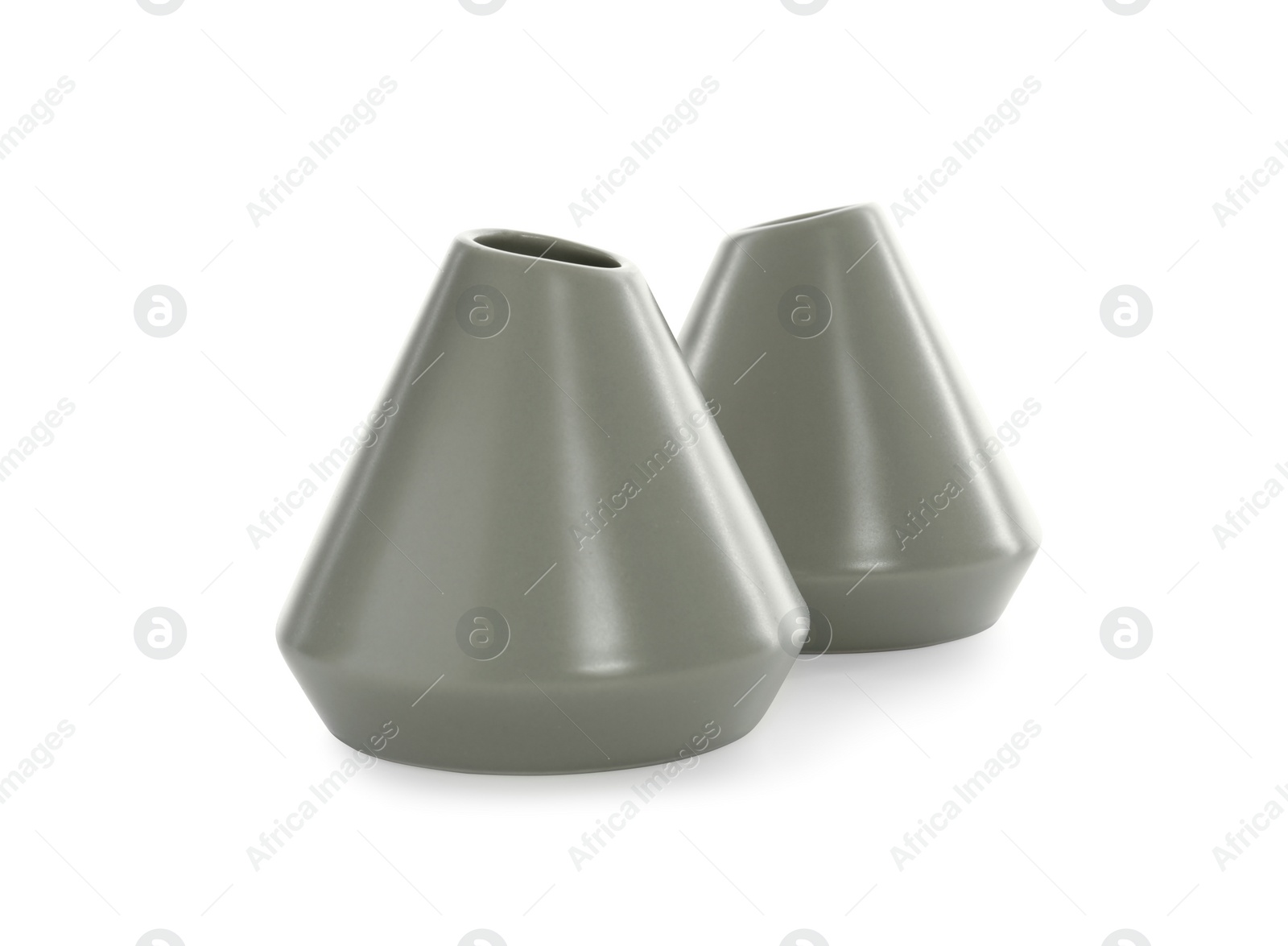 Photo of Stylish empty grey ceramic vases isolated on white