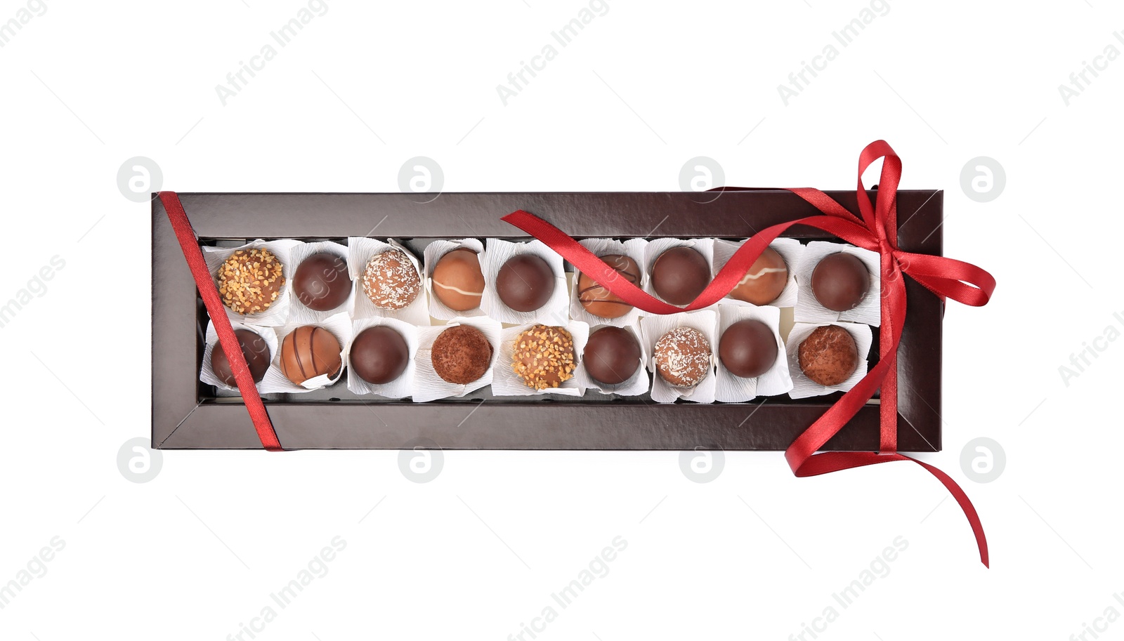 Photo of Box with delicious chocolate candies isolated on white, top view
