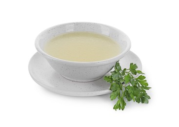 Photo of Tasty broth in bowl and parsley isolated on white