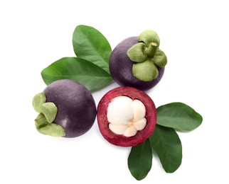 Fresh mangosteen fruits with green leaves on white background, top view