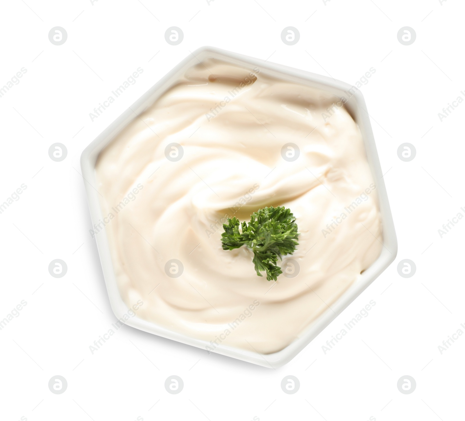 Photo of Bowl of tasty mayonnaise with parsley isolated on white, top view