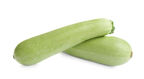 Photo of Fresh ripe green zucchinis isolated on white