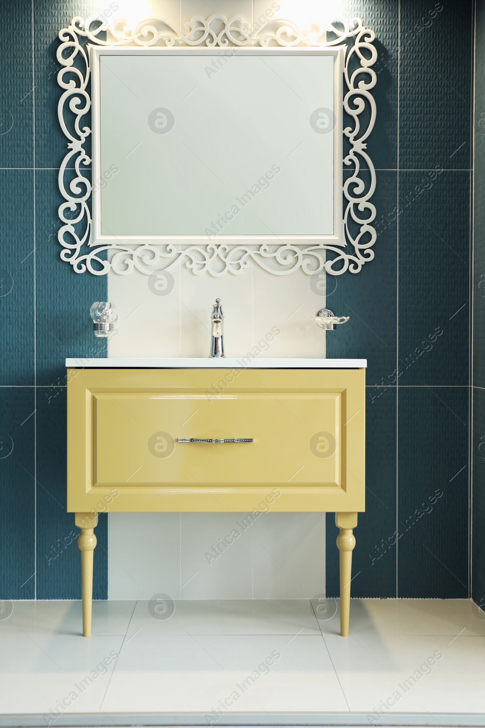 Photo of Bathroom interior with mirror and vanity unit on display in store
