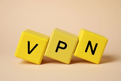 Yellow cubes with acronym VPN on beige background