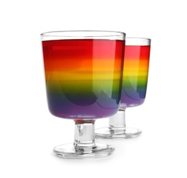 Photo of Tasty layered jelly dessert in glasses on white background