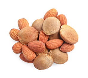 Photo of Organic dried apricot kernels on white background, top view