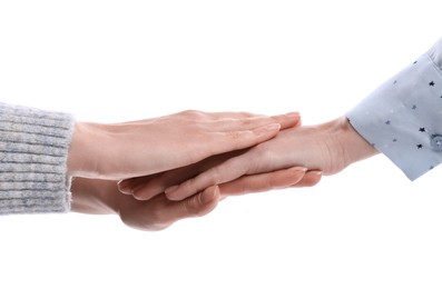 Women holding hands together on white background, closeup