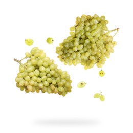 Fresh grapes in air on white background