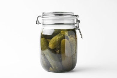 Photo of Jar with pickled cucumbers on white background