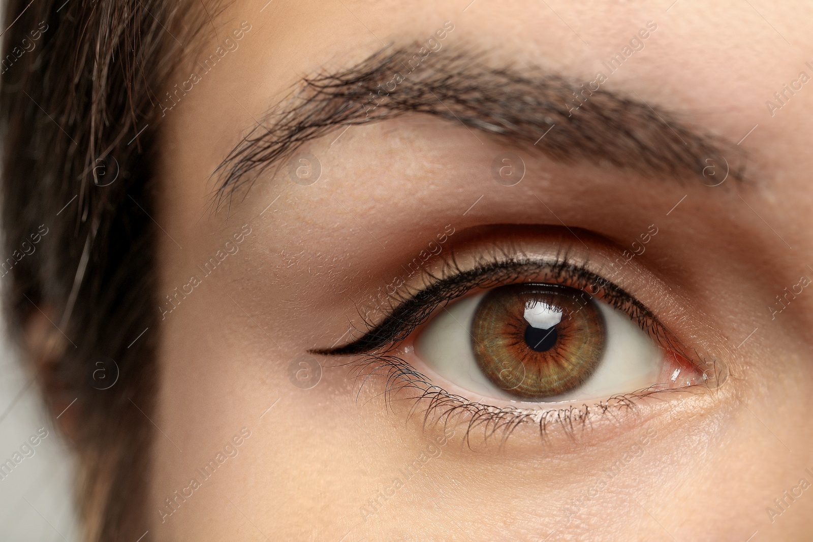 Photo of Beautiful woman with hazel eye, closeup view